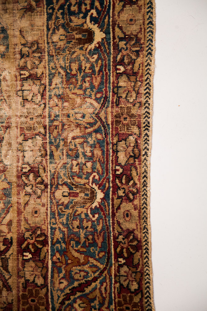 Antique distressed Persian Kerman Rug
